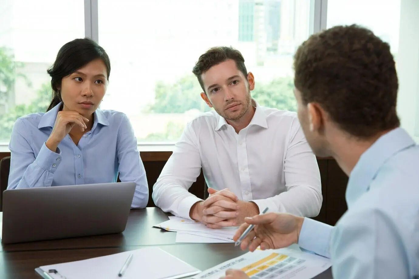 Business professionals discuss superannuation trustee services licensing.